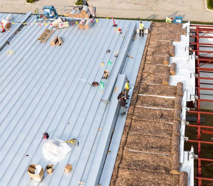 commercial roof with team of workers